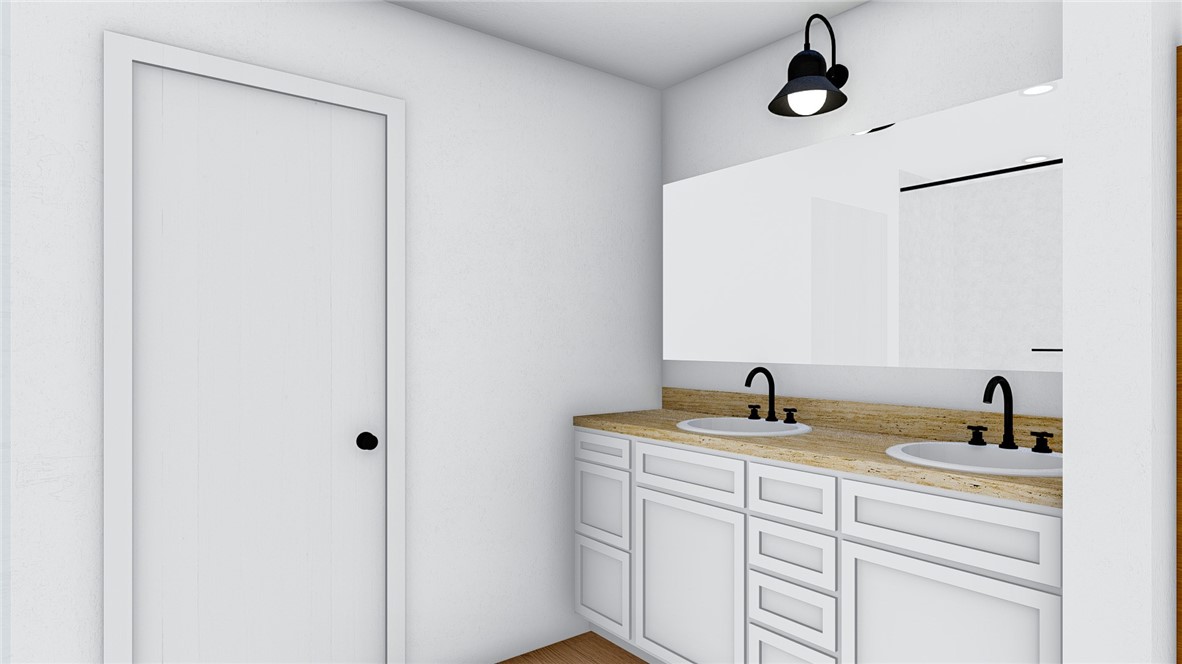 5024 Palisade Avenue Merced, CA 95348 - Photo 10 of 12 a bathroom with a sink and a mirror