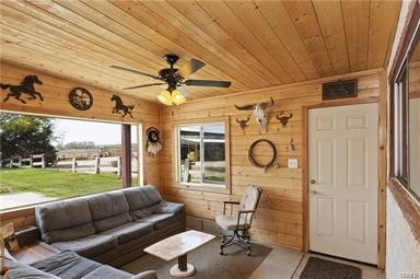 14433 Roy Rogers Ranch Road Oro Grande, CA 92368 - Photo 15 of 64 a living room with furniture and a large window