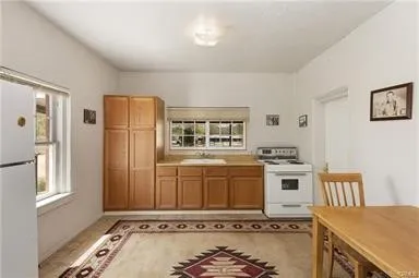 a bathroom with a sink mirror and toilet