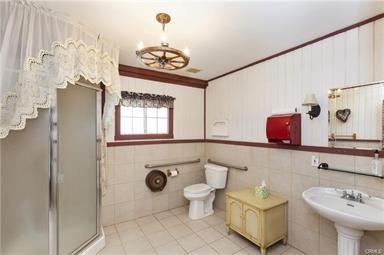 14433 Roy Rogers Ranch Road Oro Grande, CA 92368 - Photo 27 of 64 a bathroom with a sink mirror and toilet