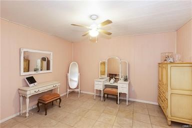 14433 Roy Rogers Ranch Road Oro Grande, CA 92368 - Photo 28 of 64 a living room with furniture a table and a chandelier