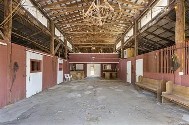 14433 Roy Rogers Ranch Road Oro Grande, CA 92368 - Photo 47 of 64 a view of a house with a large tree and wooden fence