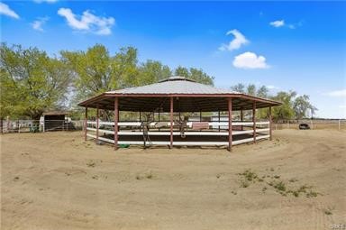 14433 Roy Rogers Ranch Road Oro Grande, CA 92368 - Photo 50 of 64 a view of a house with a yard and sitting area