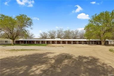 14433 Roy Rogers Ranch Road Oro Grande, CA 92368 - Photo 51 of 64 a view of a house with a yard