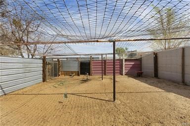 14433 Roy Rogers Ranch Road Oro Grande, CA 92368 - Photo 57 of 64 a view of a garage