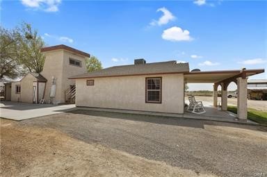 14433 Roy Rogers Ranch Road Oro Grande, CA 92368 - Photo 6 of 64 a view of a house with a patio