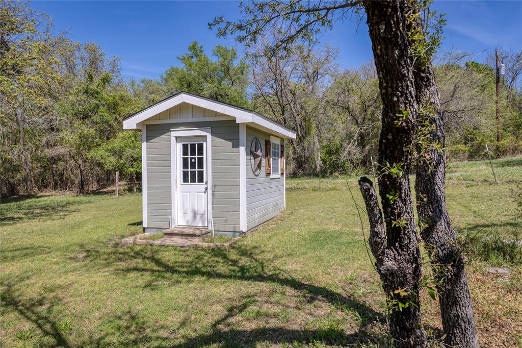 1701 Central Road Weatherford, TX 76088 - Photo 4 of 40 View of shed with view of wooded area