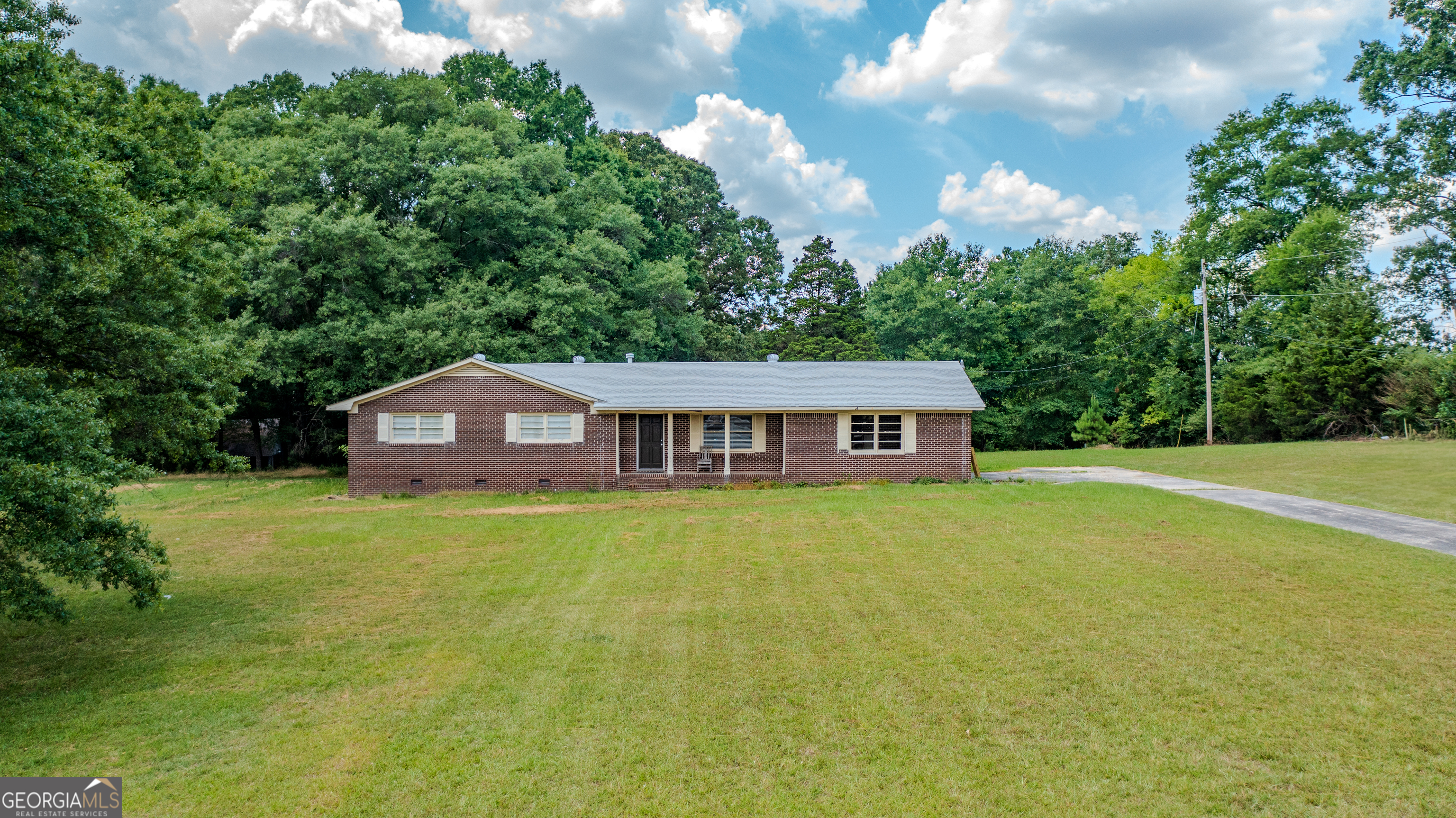 655 Collard Valley Road Cedartown, GA 30125 - Photo 1 of 1 a view of a big house with a big yard and large trees