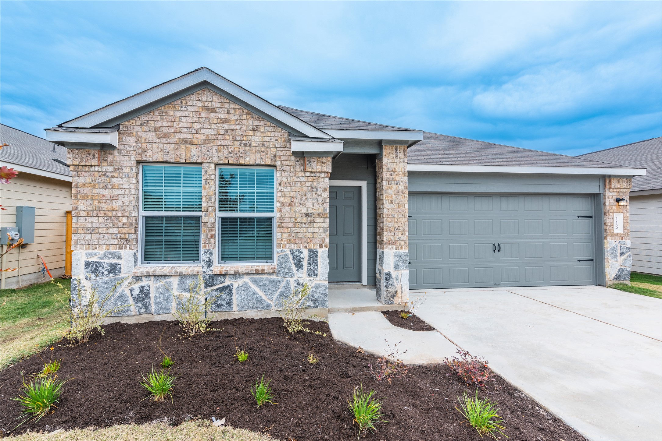 116 The Ugly Way Jarrell, TX 76537 - Photo 1 of 27 a front view of a house with a yard