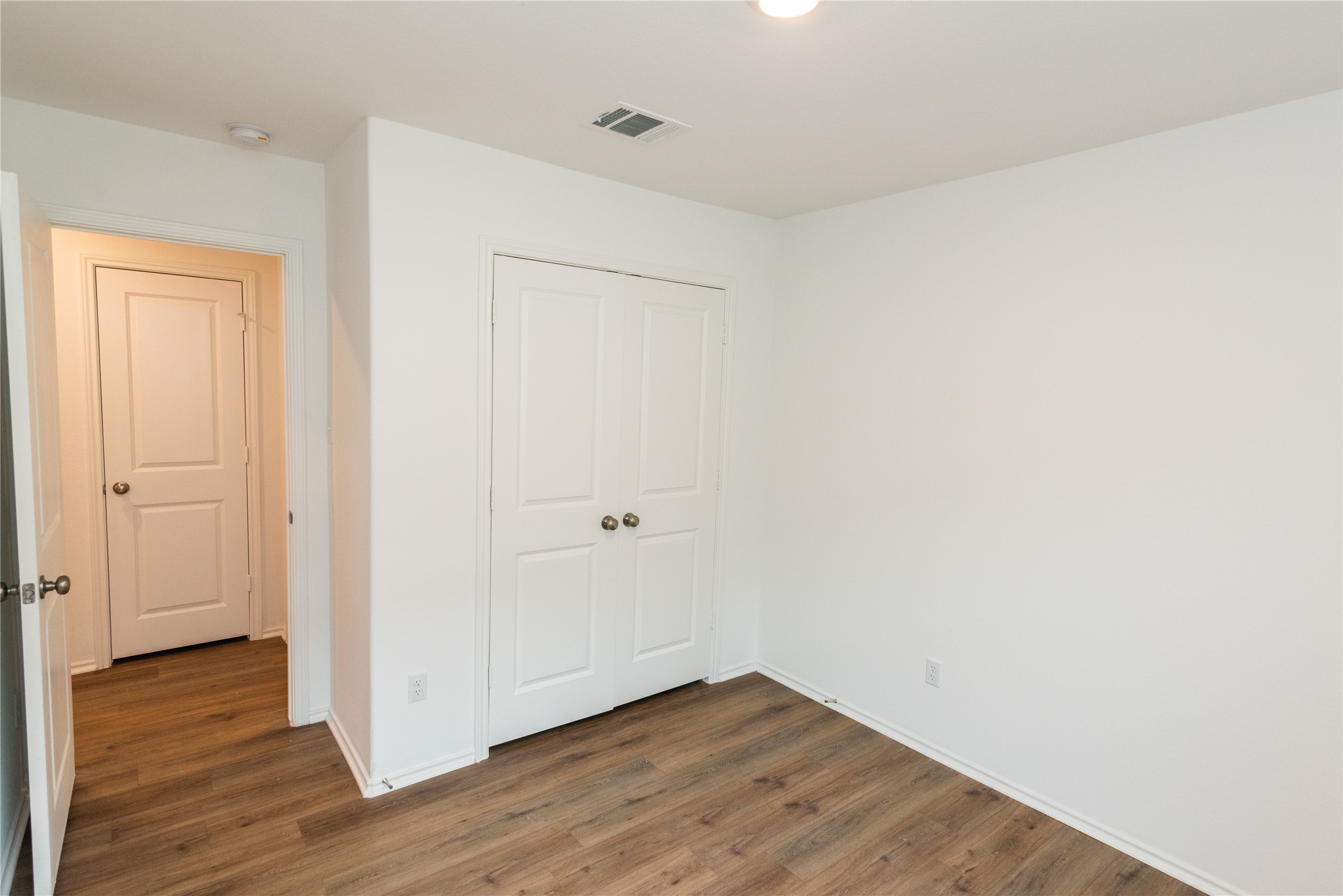 116 The Ugly Way Jarrell, TX 76537 - Photo 15 of 27 a view of an empty room with wooden floor