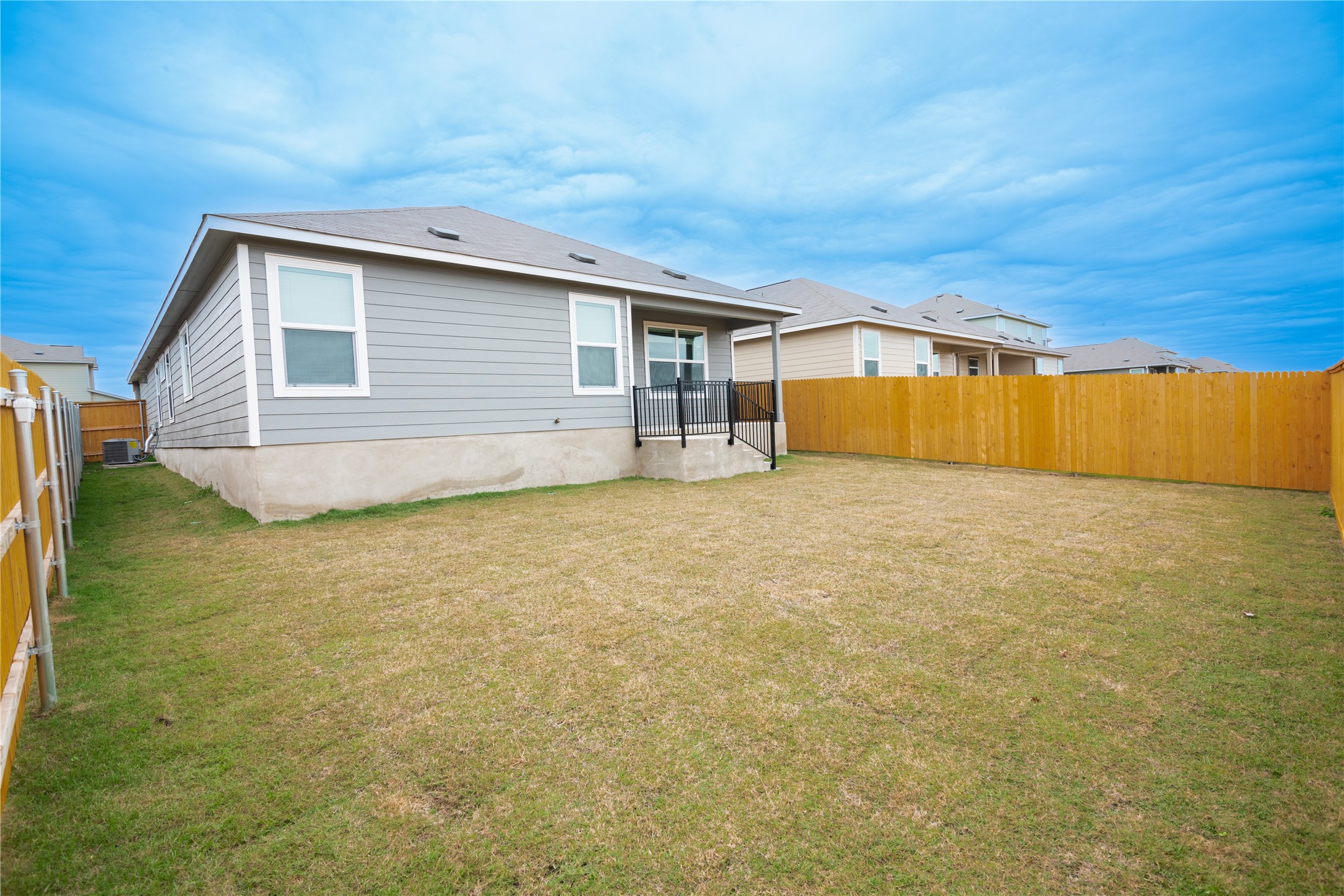 116 The Ugly Way Jarrell, TX 76537 - Photo 27 of 27 a view of an house with backyard space and balcony