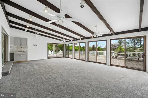 a view of an empty room with windows