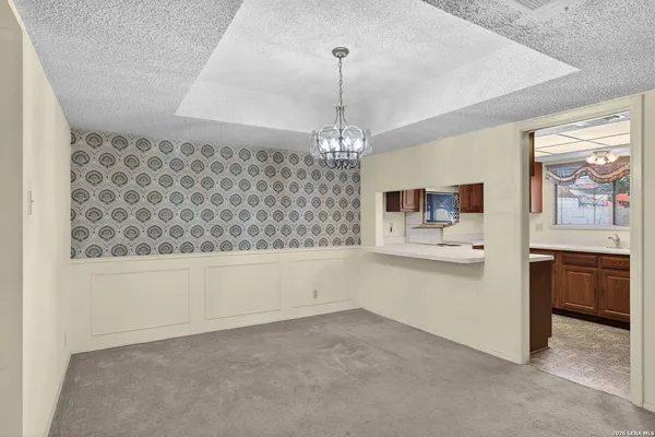 a view of a dining room with furniture and window