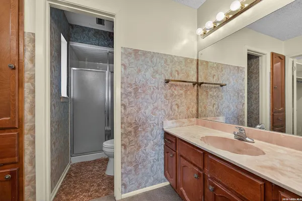 a bathroom with a sink and a mirror