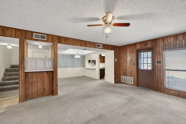 a view of an empty room with a window