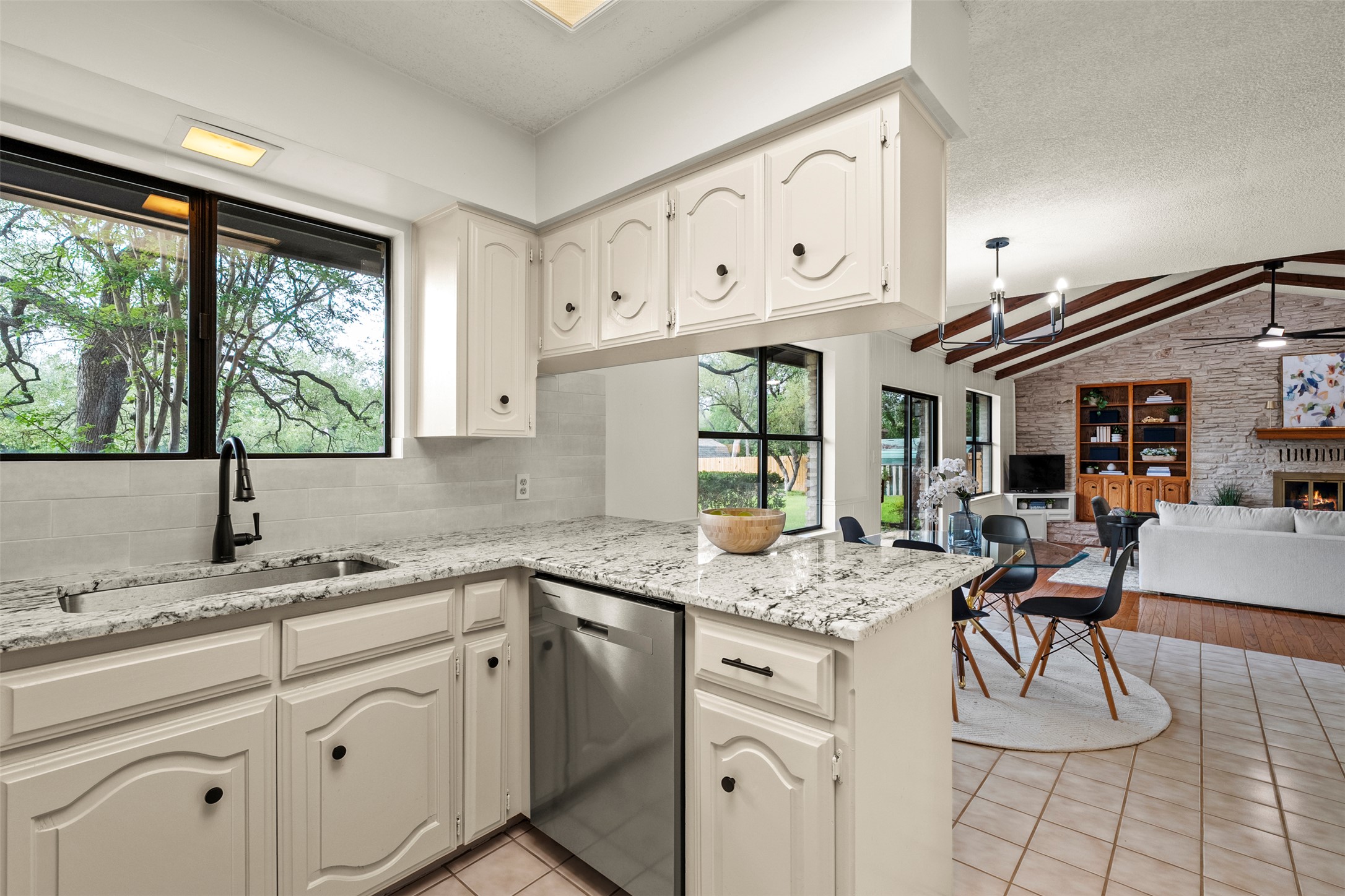 303 West Sequoia Spur Georgetown, TX 78628 - Photo 4 of 34 a kitchen with stainless steel appliances granite countertop a sink and cabinets