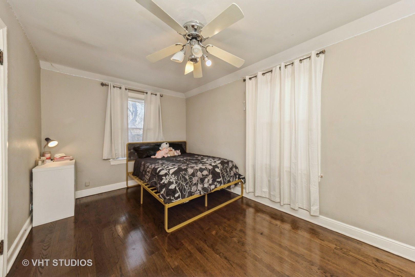 221 Cornwall Drive Crete, IL 60417 - Photo 13 of 26 a bedroom with a bed and a chandelier
