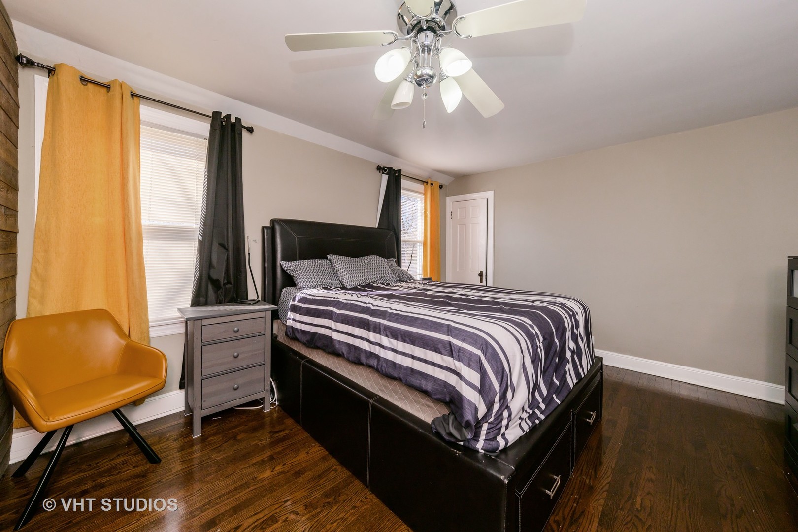 221 Cornwall Drive Crete, IL 60417 - Photo 15 of 26 a bedroom with a bed and a chandelier