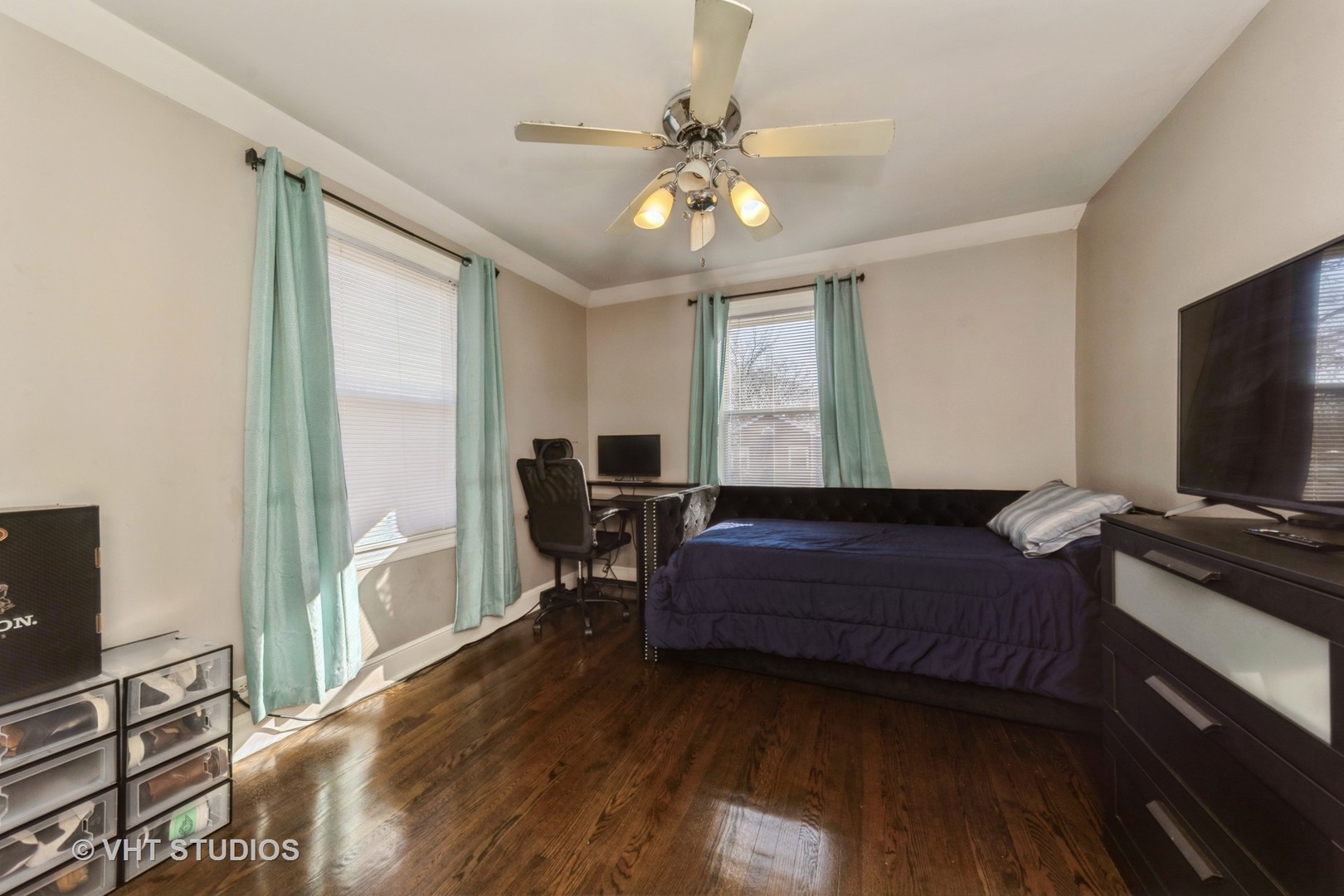221 Cornwall Drive Crete, IL 60417 - Photo 17 of 26 a living room with a bed furniture and a flat tv screen