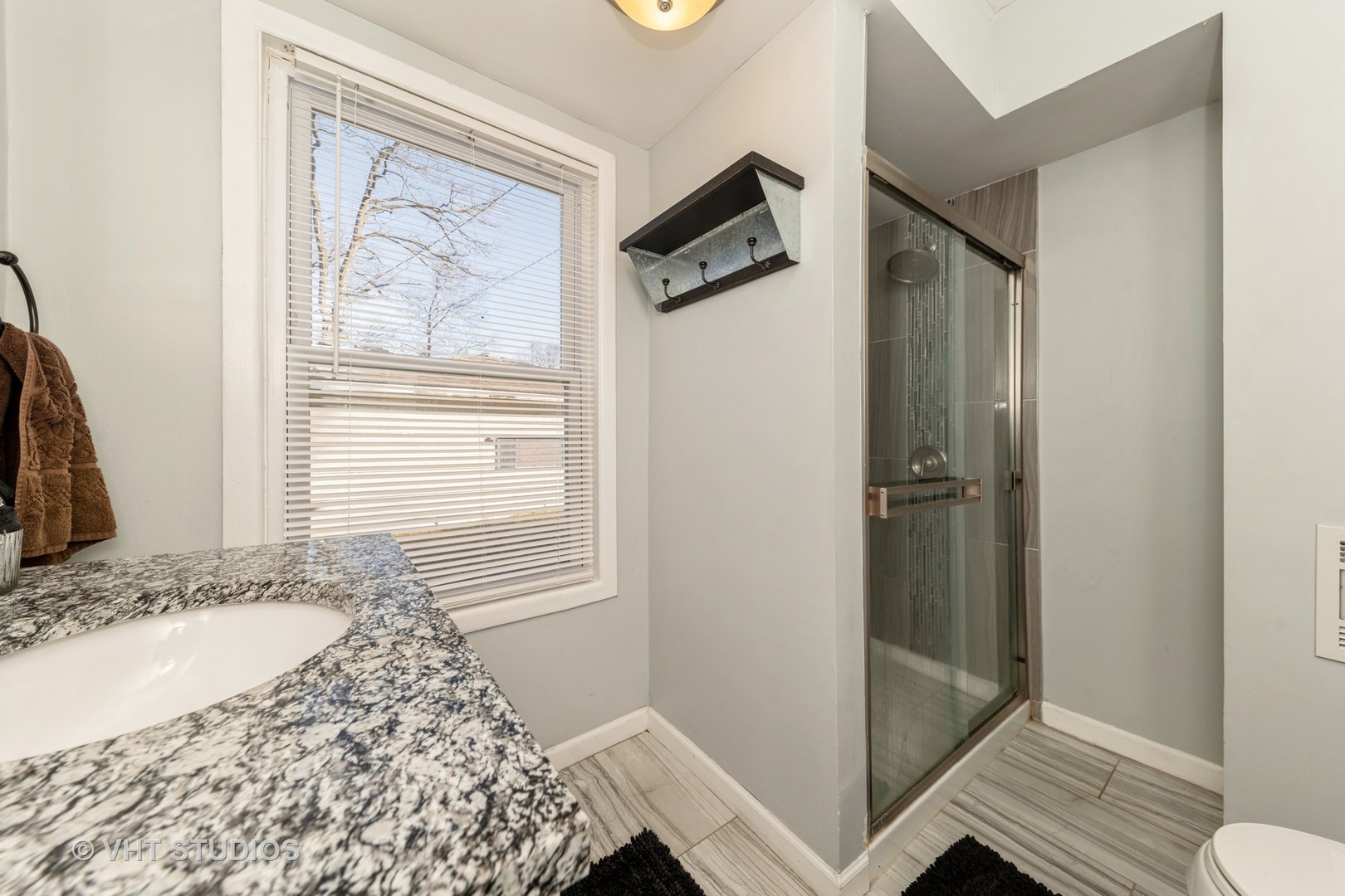 221 Cornwall Drive Crete, IL 60417 - Photo 19 of 26 a bathroom with a granite countertop sink a mirror and shower