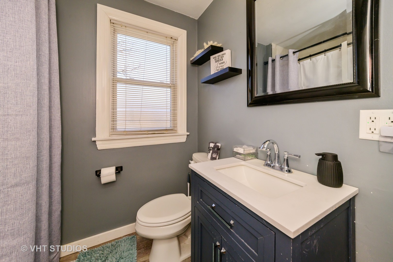221 Cornwall Drive Crete, IL 60417 - Photo 20 of 26 a bathroom with a toilet sink and mirror