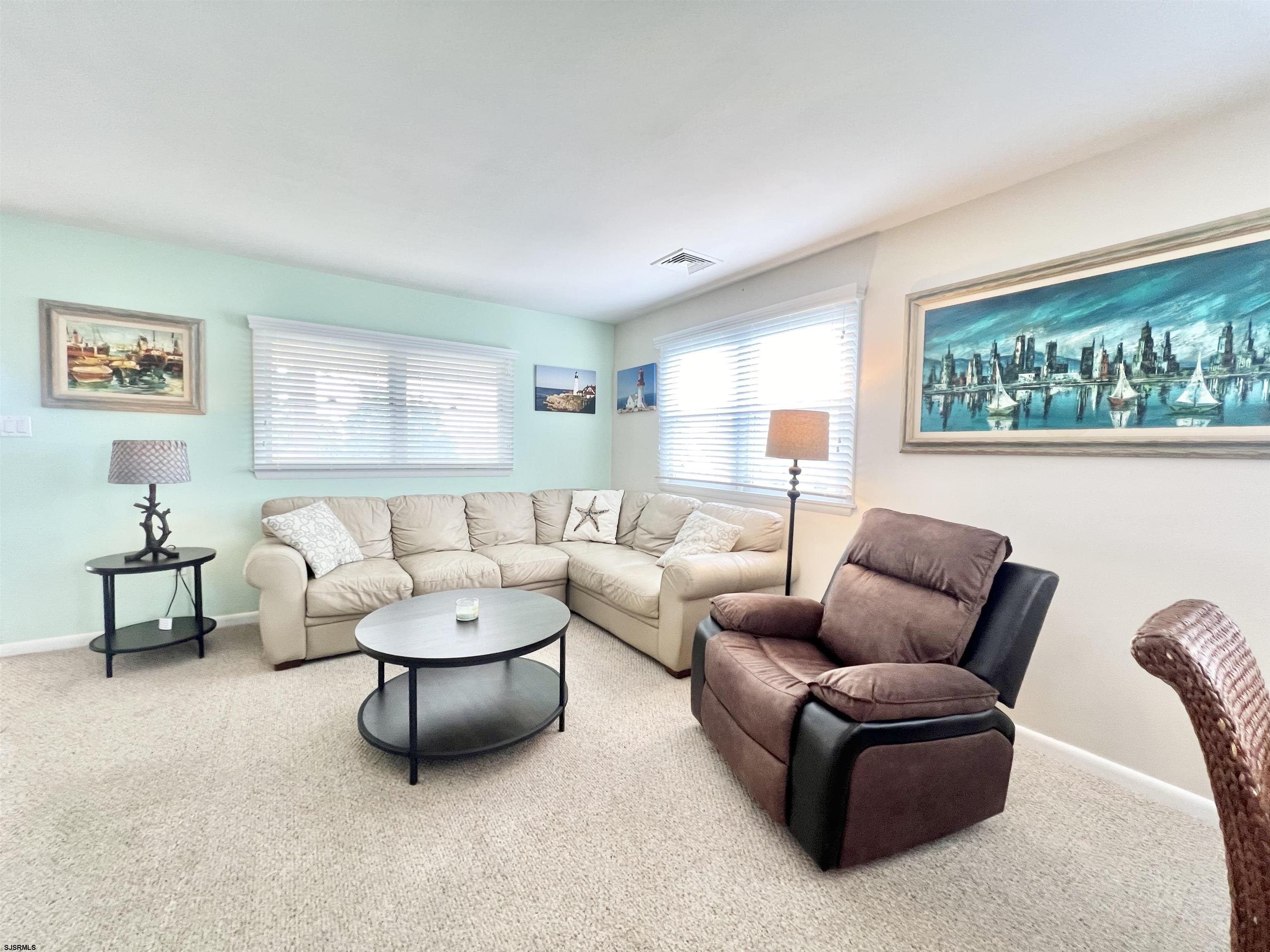 3 Simpson Road, Unit 2 Ocean City, NJ 08226 - Photo 11 of 23 a living room with furniture and a large window