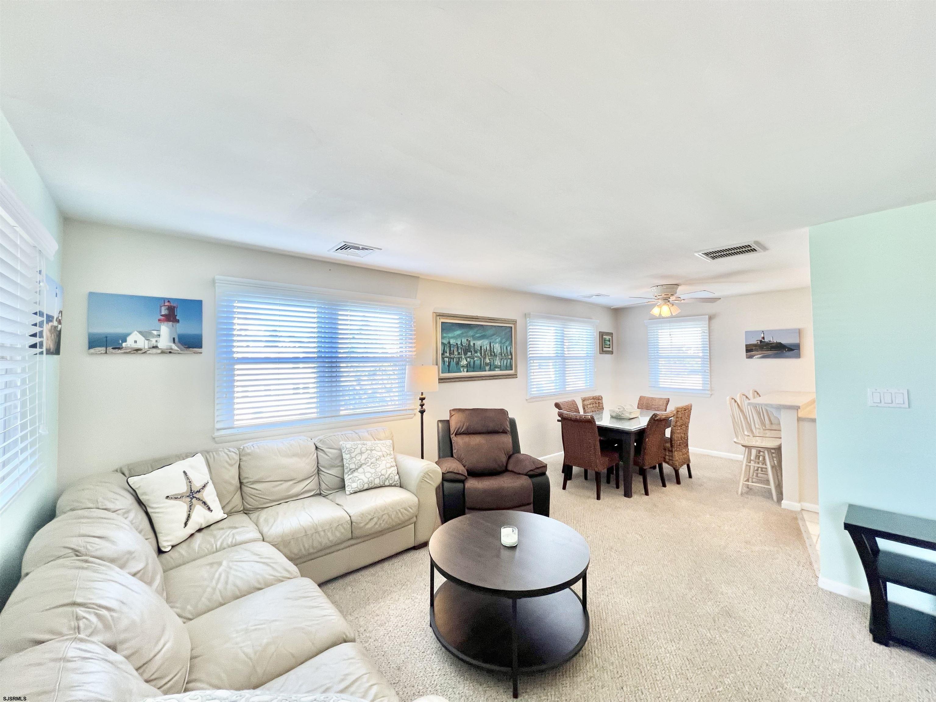 3 Simpson Road, Unit 2 Ocean City, NJ 08226 - Photo 12 of 23 a living room with furniture and a large window