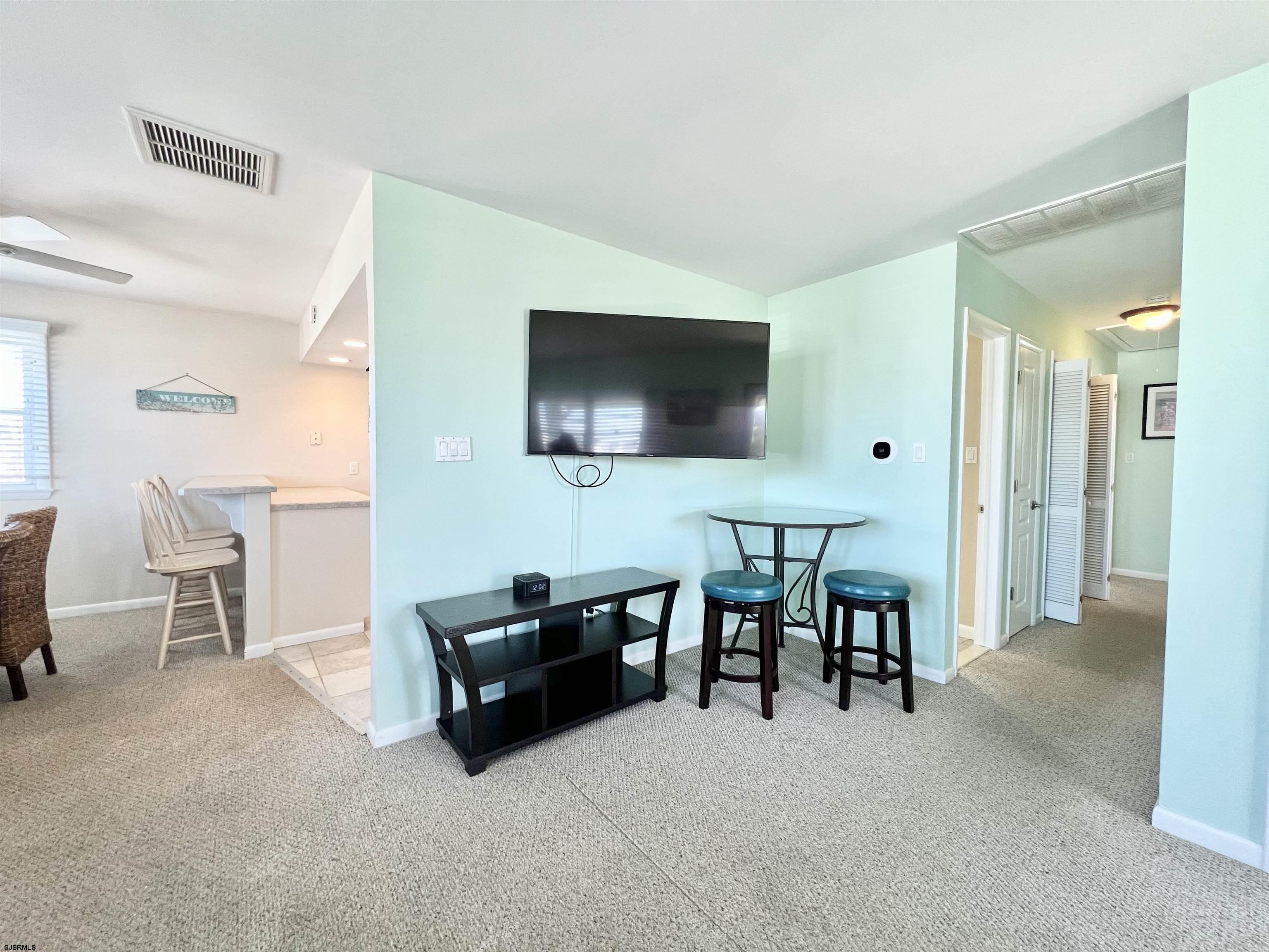 3 Simpson Road, Unit 2 Ocean City, NJ 08226 - Photo 13 of 23 a living room with furniture and a flat screen tv