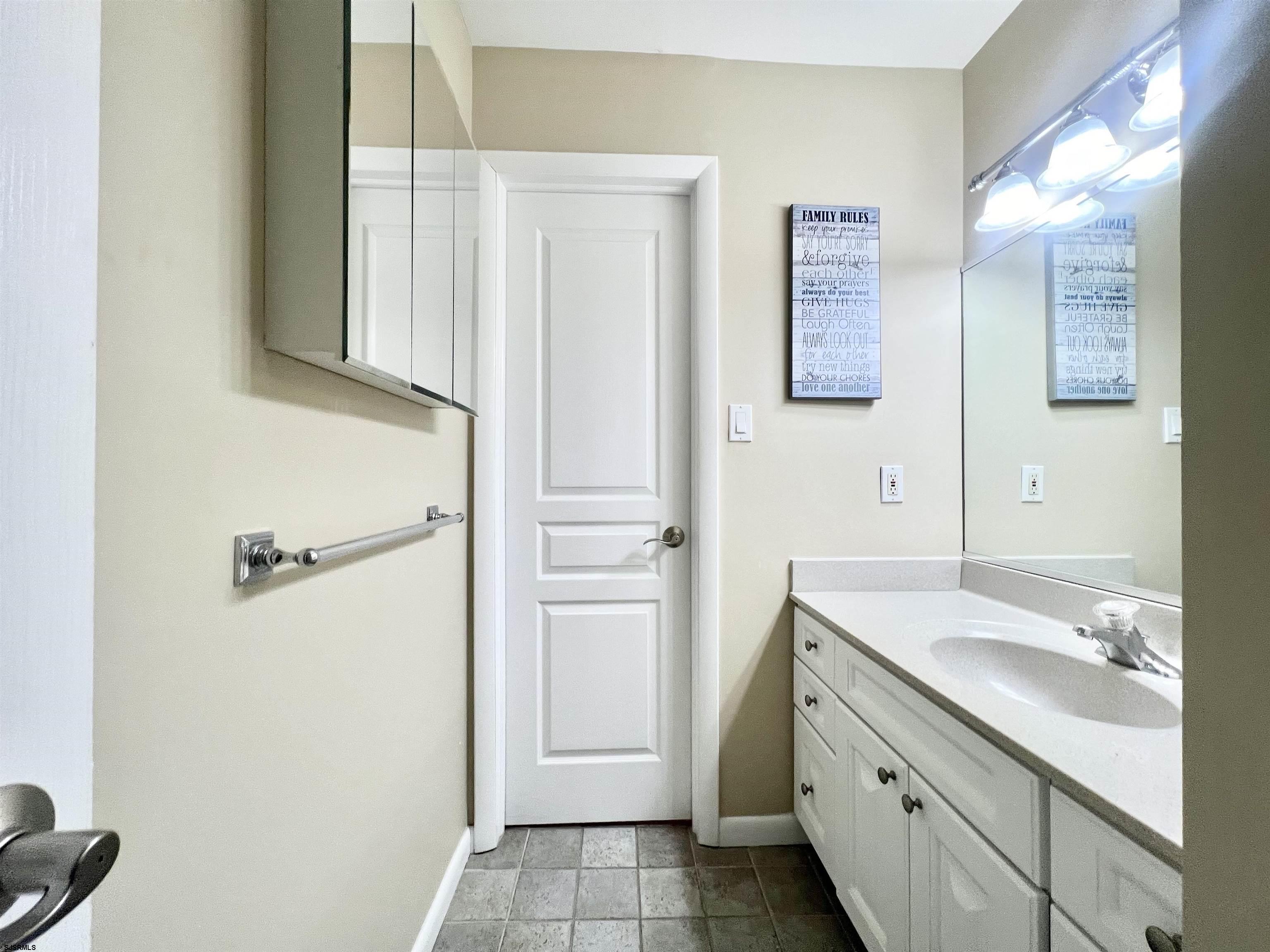 3 Simpson Road, Unit 2 Ocean City, NJ 08226 - Photo 14 of 23 a bathroom with a sink and a mirror