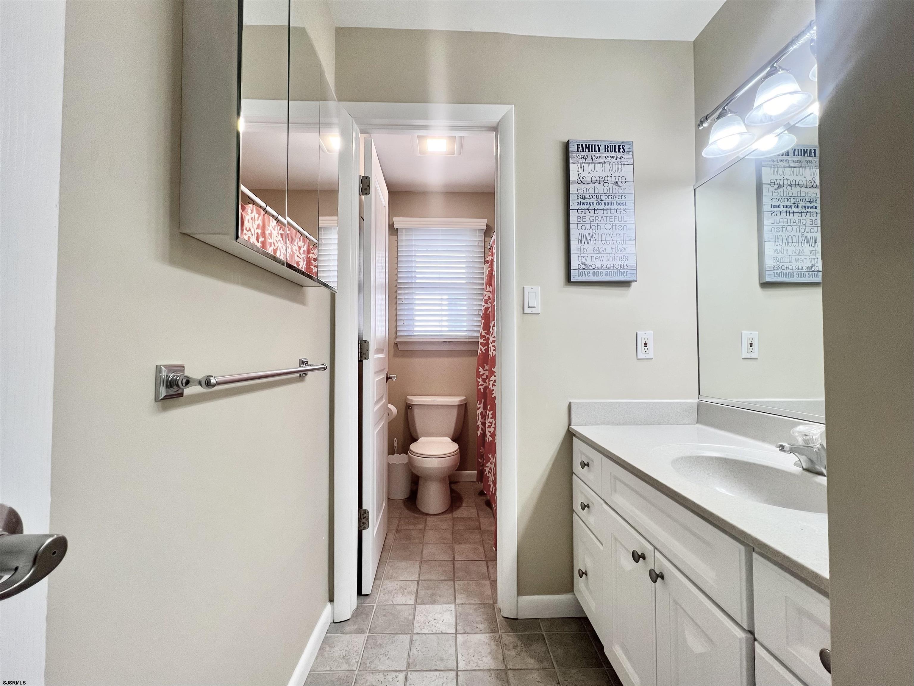 3 Simpson Road, Unit 2 Ocean City, NJ 08226 - Photo 15 of 23 a bathroom with a granite countertop sink toilet and shower