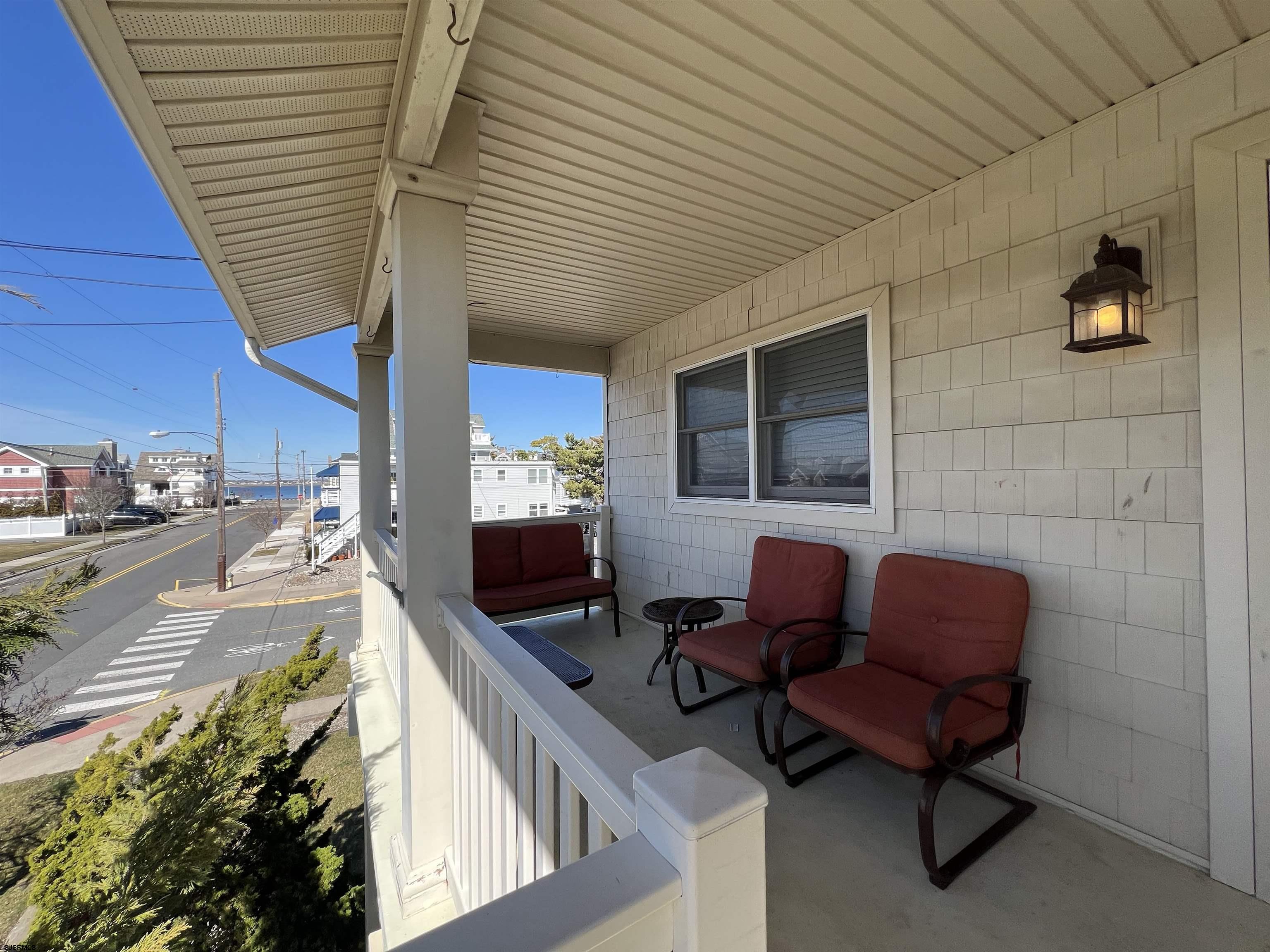 3 Simpson Road, Unit 2 Ocean City, NJ 08226 - Photo 3 of 23 a balcony with furniture and a potted plant