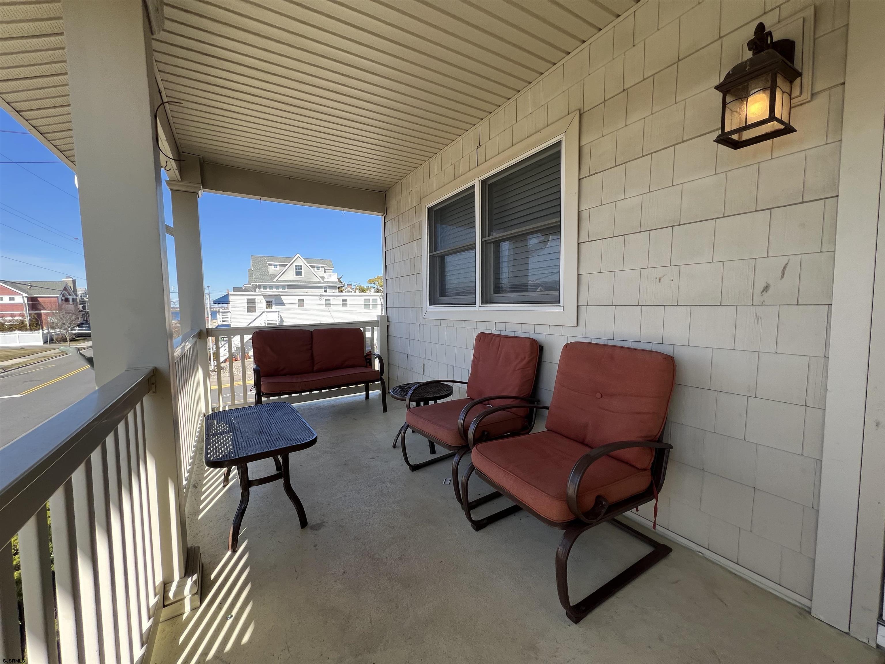 3 Simpson Road, Unit 2 Ocean City, NJ 08226 - Photo 4 of 23 a living room with furniture and a lamp