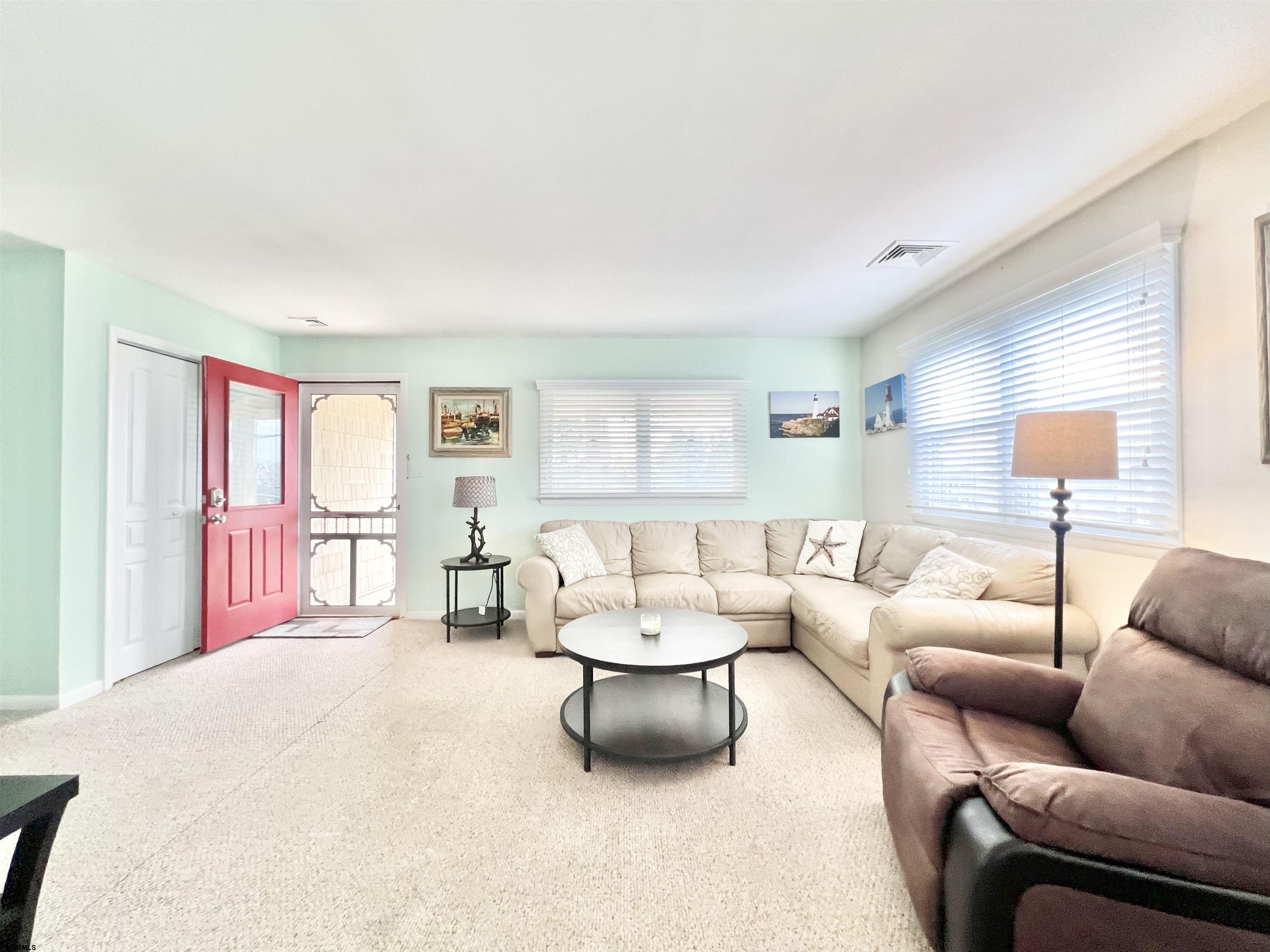 3 Simpson Road, Unit 2 Ocean City, NJ 08226 - Photo 10 of 23 a living room with furniture and a large window