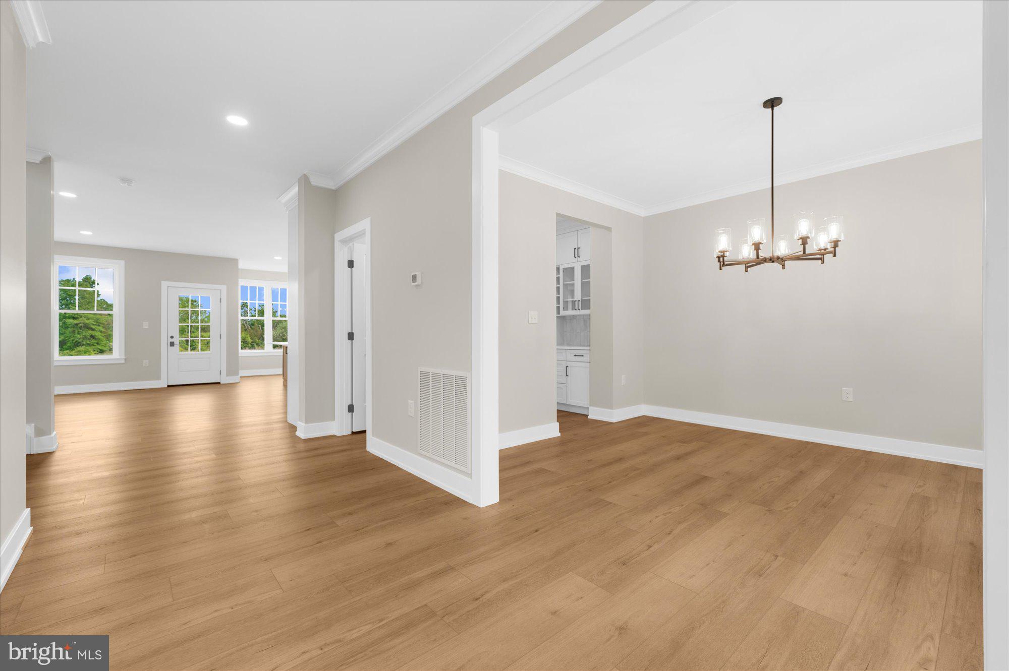 394 Renninger Road Perkiomenville, PA 18074 - Photo 13 of 41 a view of a room with wooden floor a ceiling fan and windows