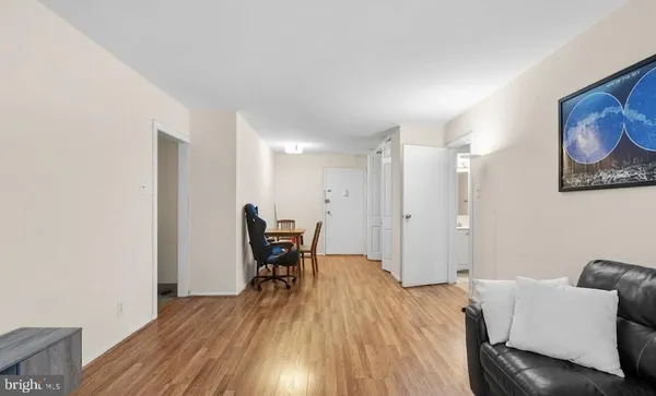 a view of a livingroom with furniture and wooden floor