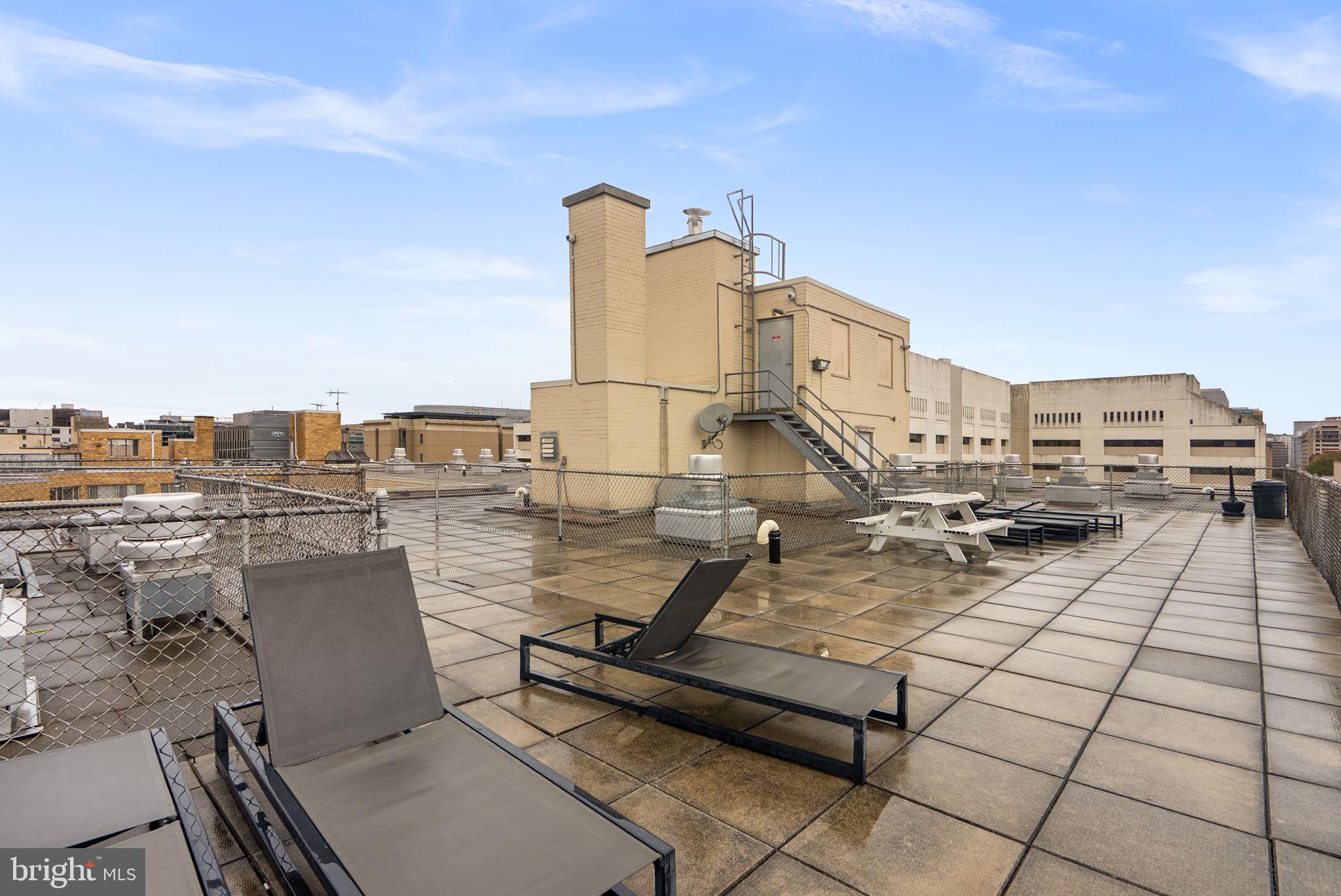 2401 H Street Northwest, Unit 211 Washington, DC 20037 - Photo 10 of 14 a view of a terrace with seating space