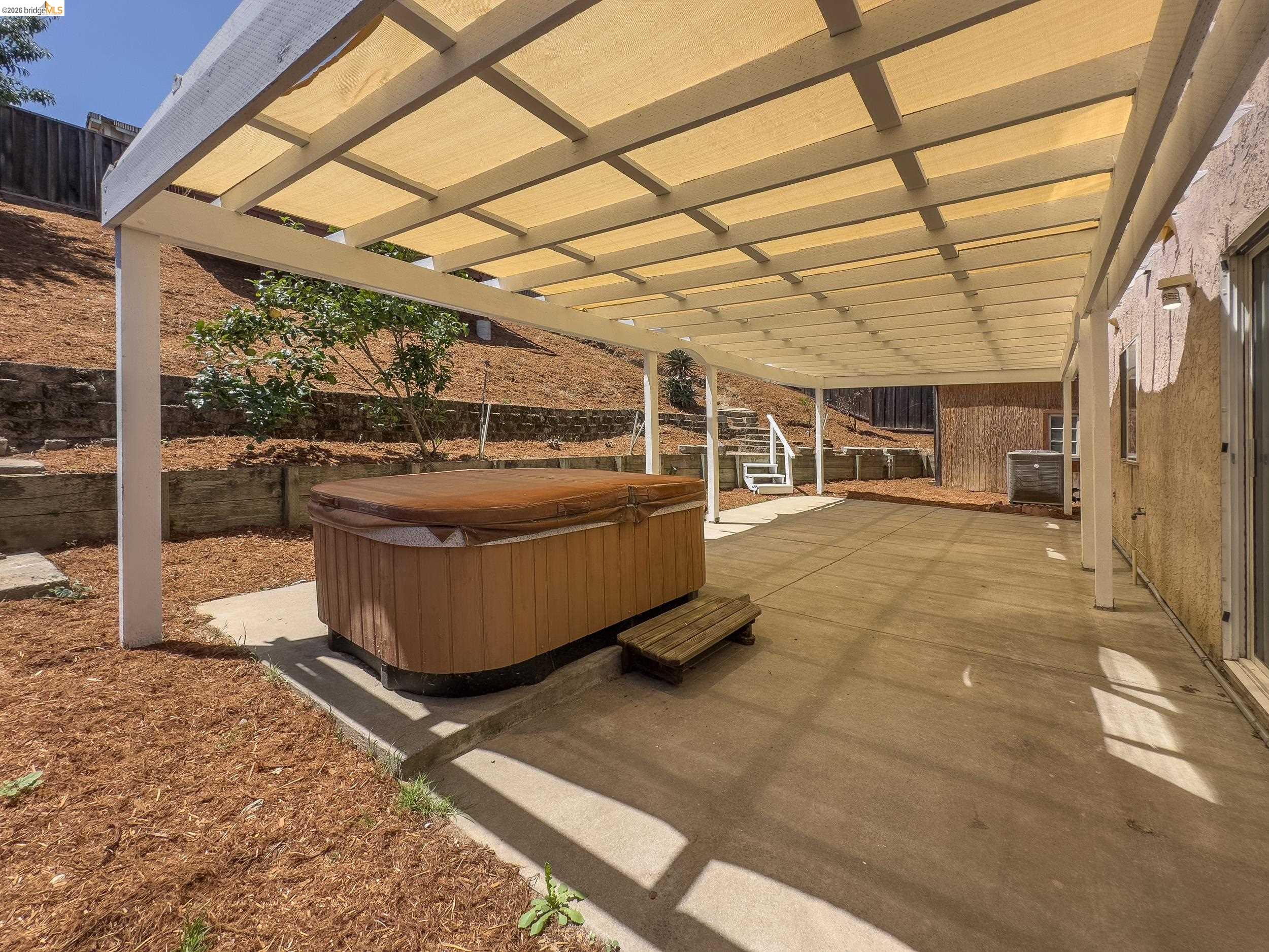 512 Burdick Drive Bay Point, CA 94565 - Photo 35 of 50 Expansive concrete patio featuring a large shade pergola with light-colored fabric panels