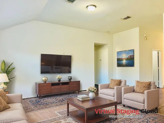 a living room with furniture and a flat screen tv