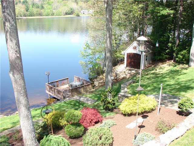 102 Indian Spring Road Woodstock, CT 06282 - Photo 1 of 1 a backyard of a house with outdoor seating