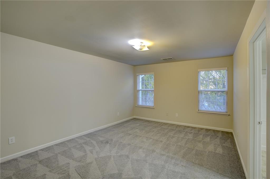 2161 Meadow Peak Road Duluth, GA 30097 - Photo 15 of 25 an empty room with windows