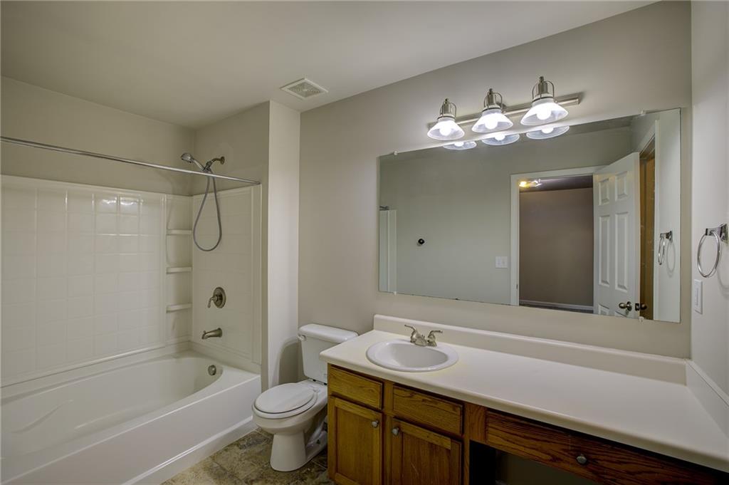 2161 Meadow Peak Road Duluth, GA 30097 - Photo 17 of 25 a bathroom with a sink a toilet and shower