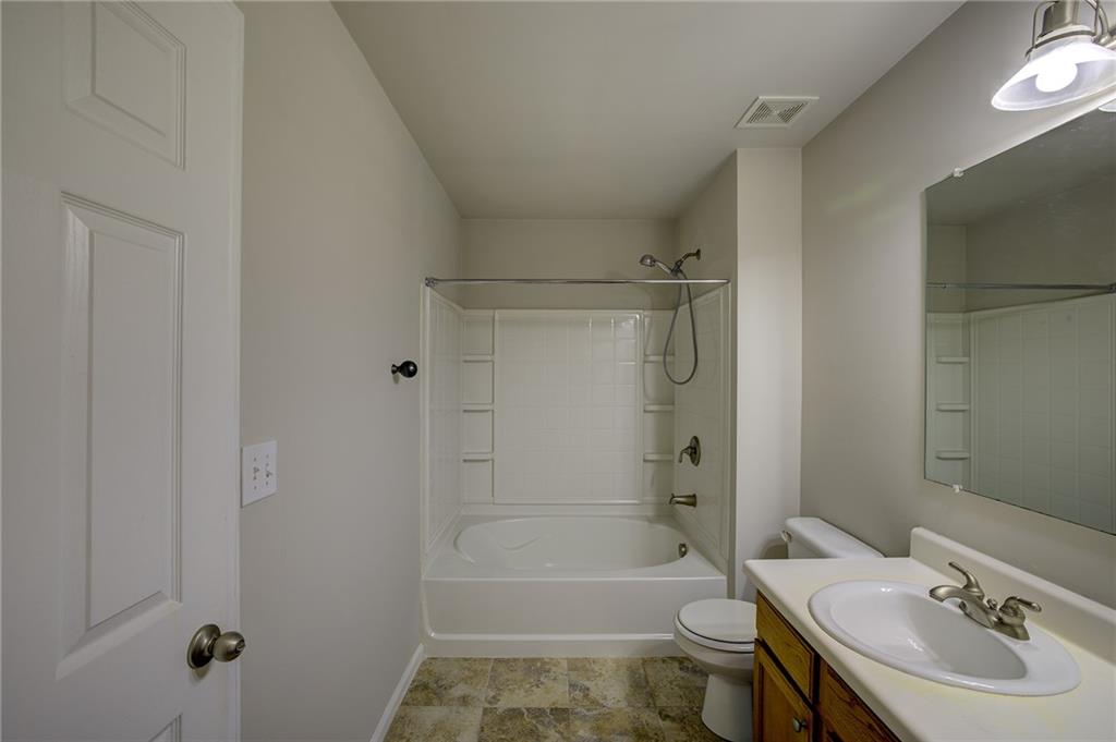 2161 Meadow Peak Road Duluth, GA 30097 - Photo 19 of 25 a bathroom with a sink toilet tub and shower
