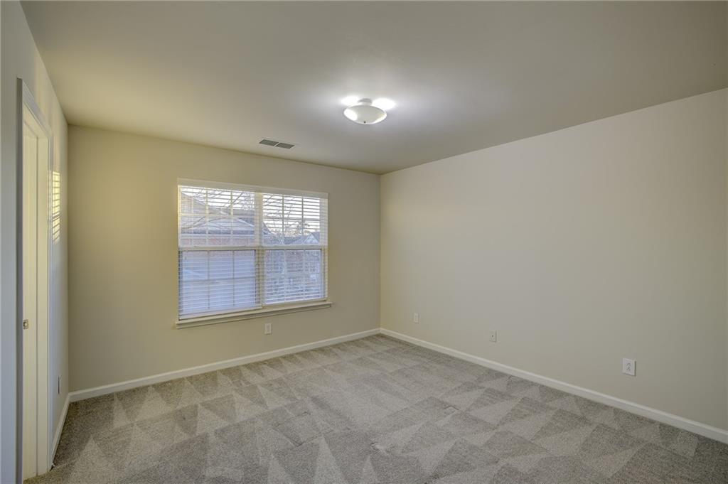 2161 Meadow Peak Road Duluth, GA 30097 - Photo 22 of 25 an empty room with windows