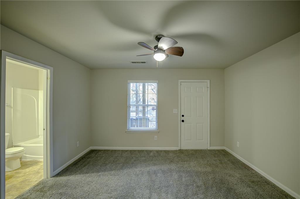 2161 Meadow Peak Road Duluth, GA 30097 - Photo 3 of 25 a view of an empty room with a window