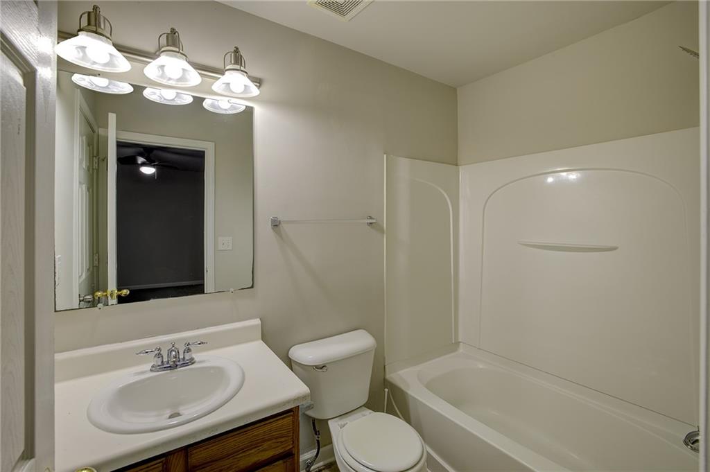 2161 Meadow Peak Road Duluth, GA 30097 - Photo 5 of 25 a bathroom with a sink a toilet and shower
