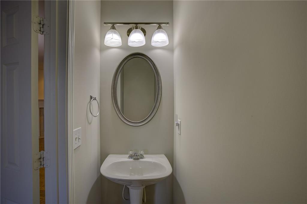 2161 Meadow Peak Road Duluth, GA 30097 - Photo 9 of 25 a bathroom with a sink and a mirror