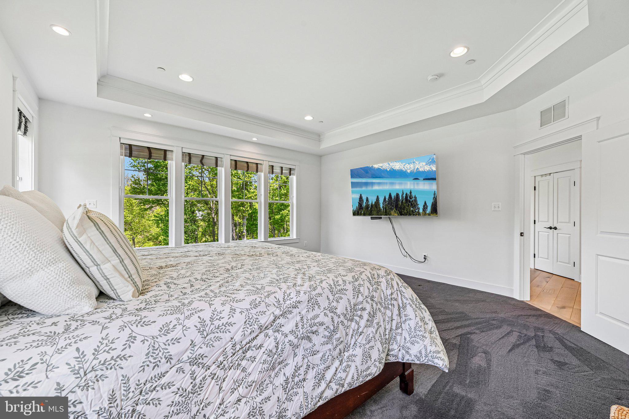 14516 Old Frederick Road Cooksville, MD 21723 - Photo 34 of 100 a spacious bedroom with a large bed and a large window