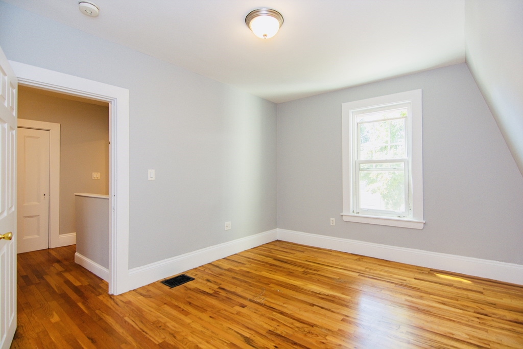 44 Cottage Street Lynn, MA 01905 - Photo 19 of 37 a view of empty room with wooden floor and fan