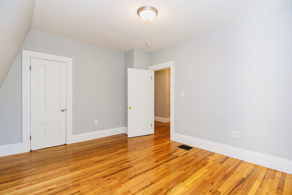 44 Cottage Street Lynn, MA 01905 - Photo 20 of 37 a view of an empty room and wooden floor