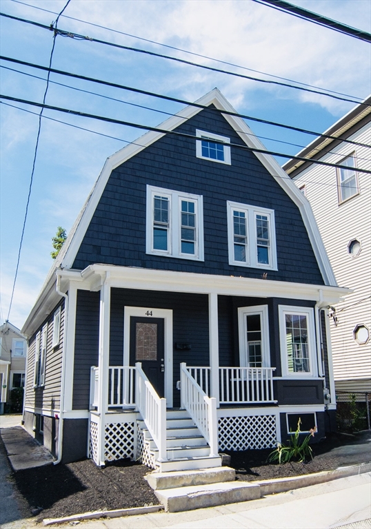 44 Cottage Street Lynn, MA 01905 - Photo 2 of 37 a front view of a house with a yard
